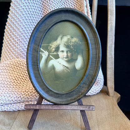 Antique Cupid Awake Print – Oval Metal Frame