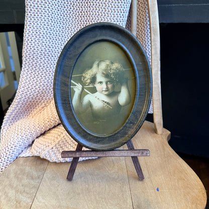 Antique Cupid Awake Print – Oval Metal Frame