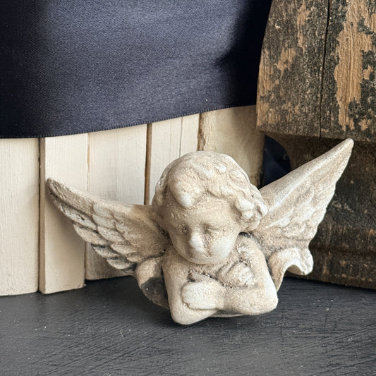 Pouting Cherub Wall Plaque