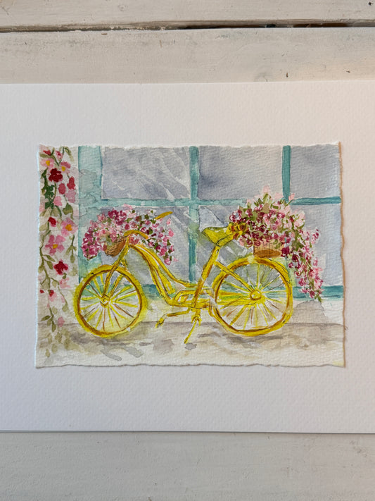 watercolor yellow bicycle with flowers against a light background